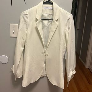 Excellent condition. Never worn. Tags on. Ribbon tie on cuffs